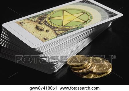 Close-up of a stack of tarot cards with coins View Large Photo Image Stock Image - Close-up of a stack of tarot cards with coins. Fotosearch