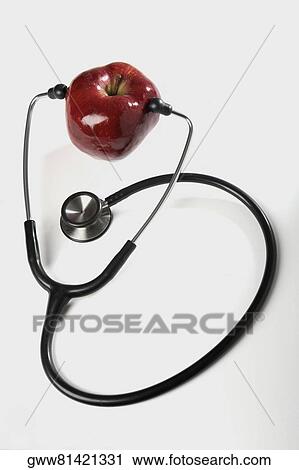 Close-up of a stethoscope with an apple View Large Photo Image Stock Image - Close-up of a stethoscope with an apple. Fotosearch