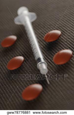 Close-up of a syringe with five pills View Large Photo Image Stock Image - Close-up of a syringe with five pills. Fotosearch