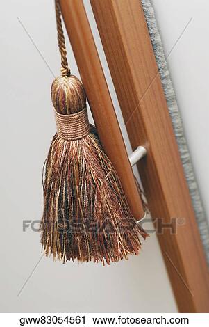 Close-up of a tassel hanging on a door View Large Photo Image Stock Image - Close-up of a tassel hanging on a door. Fotosearch