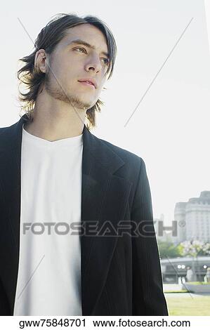 Close-up of a teenage boy standing View Large Photo Image Stock Image - Close-up of a teenage boy standing. Fotosearch