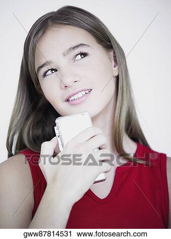 Close-up of a teenage girl listening to a tape recorder View Large Photo Image Stock Image - Close-up of a teenage girl listening to a tape recorder. Fotosearch