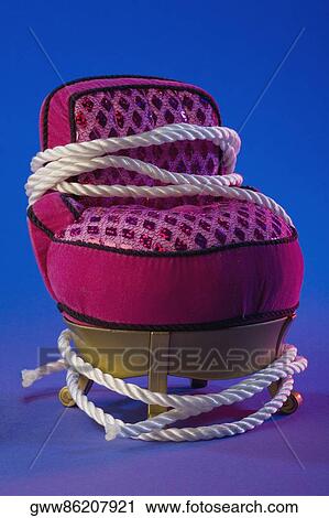 Close-up of a toy chair with a rope around it View Large Photo Image Stock Image - Close-up of a toy chair with a rope around it. Fotosearch