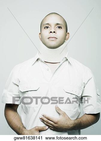 Close-up of a young man wearing a neck brace View Large Photo Image Stock Image - Close-up of a young man wearing a neck brace. Fotosearch