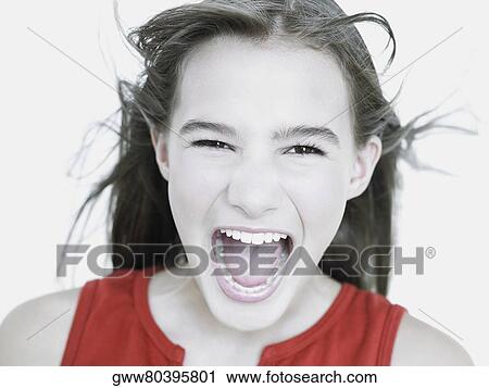 Close-up of a young woman shouting View Large Photo Image Stock Image - Close-up of a young woman shouting. Fotosearch