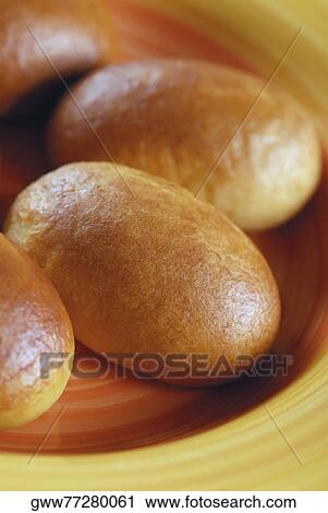 Stock Image - Close-up of buns in a bowl. Fotosearch