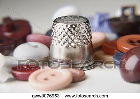 Stock Image - Close-up of buttons with a metal cap. Fotosearch