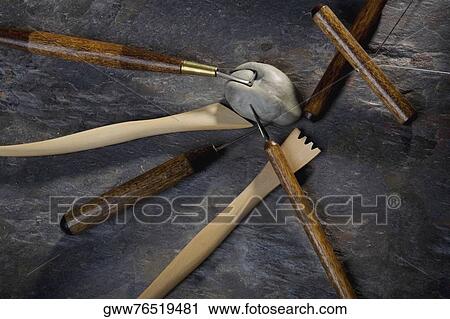 Close-up of carving tools with clay View Large Photo Image Stock Image - Close-up of carving tools with clay. Fotosearch
