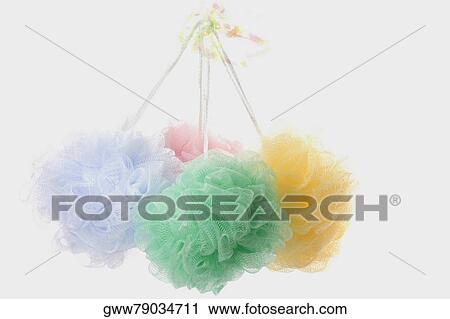 Stock Image - Close-up of four bath sponges. Fotosearch