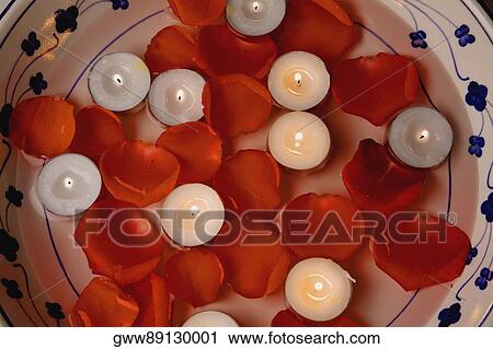 Stock Image - Close-up of lit candles. Fotosearch