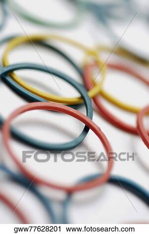 Stock Image - Close-up of multi-colored plastic bracelets. Fotosearch
