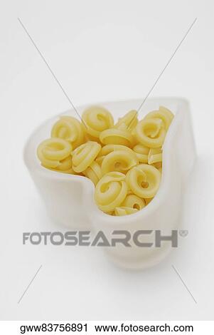 Close-up of pasta in a heart shape bowl View Large Photo Image Stock Image - Close-up of pasta in a heart shape bowl. Fotosearch