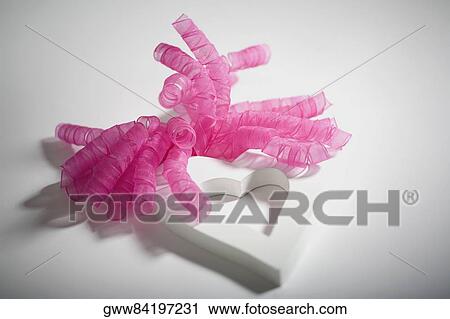 Close-up of ribbons with a heart shaped object View Large Photo Image Stock Image - Close-up of ribbons with a heart shaped object. Fotosearch