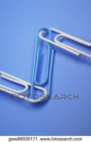 Close-up of three paper clips View Large Photo Image Stock Image - Close-up of three paper clips. Fotosearch