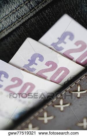 Stock Image - Close-up of twenty pound notes. Fotosearch