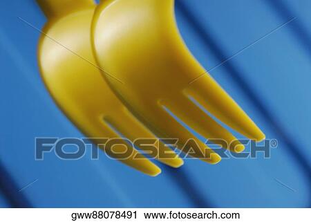 Close-up of two plastic forks View Large Photo Image Stock Image - Close-up of two plastic forks. Fotosearch