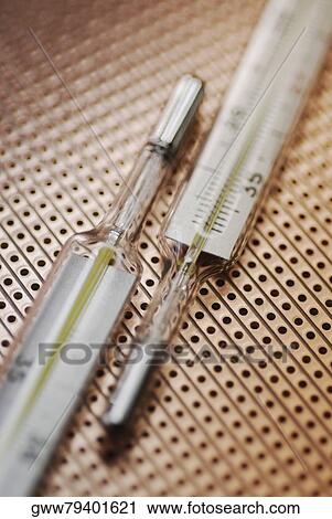Close-up of two thermometers View Large Photo Image Stock Image - Close-up of two thermometers. Fotosearch