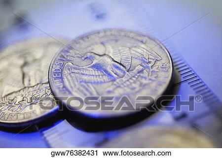 Close-up of US coins on a ruler View Large Photo Image Stock Image - Close-up of US coins on a ruler. Fotosearch