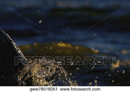 Close-up of water splashing against a rock View Large Photo Image Stock Image - Close-up of water splashing against a rock. Fotosearch
