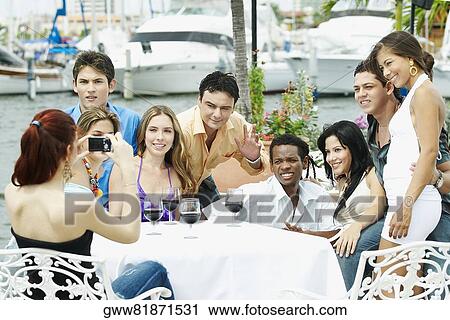 Group of people sitting in a restaurant View Large Photo Image Stock Image - Group of people sitting in a restaurant. Fotosearch