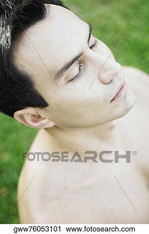 High angle view of a mature man meditating View Large Photo Image Stock Image - High angle view of a mature man meditating. Fotosearch