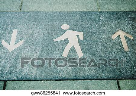 Stock Image - High angle view of a pedestrian walkway sign. Fotosearch
