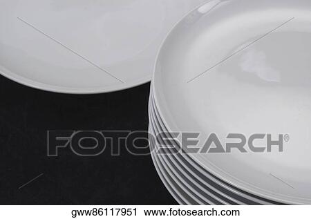 Stock Image - High angle view of a stack of plates. Fotosearch