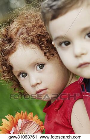 Portrait of a boy and a girl View Large Photo Image Stock Image - Portrait of a boy and a girl. Fotosearch
