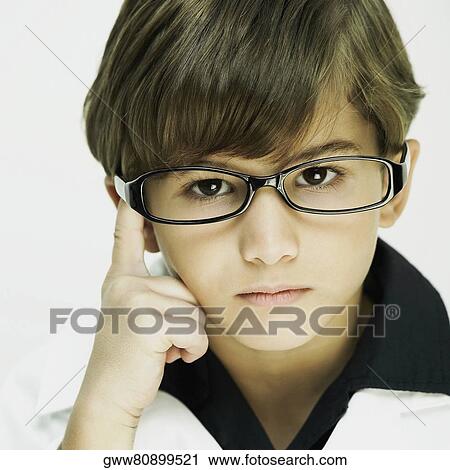 Stock Image - Portrait of a boy dressed as a doctor. Fotosearch