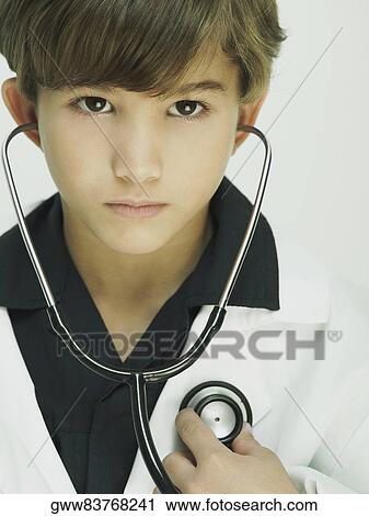 Portrait of a boy dressed as a doctor View Large Photo Image Stock Image - Portrait of a boy dressed as a doctor. Fotosearch