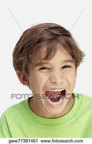 Stock Image - Portrait of a boy laughing. Fotosearch