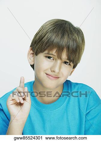 Portrait of a boy pointing upwards View Large Photo Image Stock Image - Portrait of a boy pointing upwards. Fotosearch
