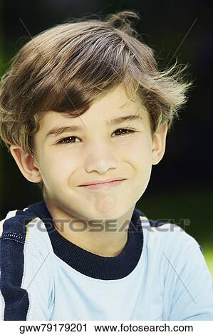 Portrait of a boy smirking View Large Photo Image Stock Image - Portrait of a boy smirking. Fotosearch