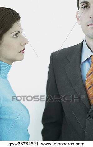Portrait of a businessman standing with a businesswoman View Large Photo Image Stock Image - Portrait of a businessman standing with a businesswoman. Fotosearch