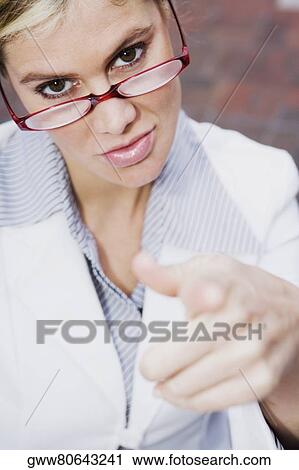 Portrait of a businesswoman pointing forward View Large Photo Image Stock Image - Portrait of a businesswoman pointing forward. Fotosearch