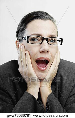 Portrait of a businesswoman with her hands on her chin View Large Photo Image Stock Image - Portrait of a businesswoman with her hands on her chin. Fotosearch