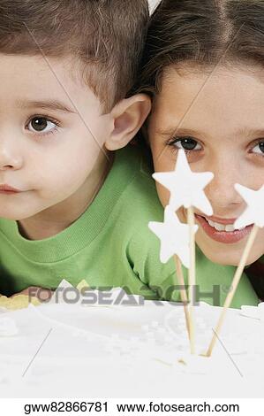Portrait of a girl smiling with her brother View Large Photo Image Stock Image - Portrait of a girl smiling with her brother. Fotosearch