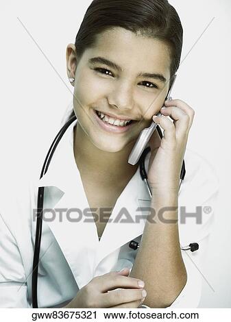 Portrait of a girl with a stethoscope around her neck and talking on a mobile phone View Large Photo Image Stock Image - Portrait of a girl with a stethoscope around her neck and talking on a mobile phone. Fotosearch