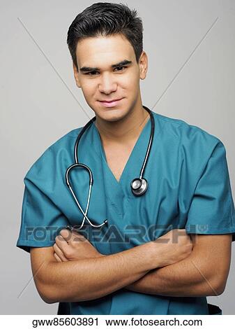 Portrait of a male surgeon smiling View Large Photo Image Stock Image - Portrait of a male surgeon smiling. Fotosearch