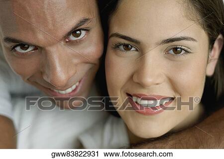 Portrait of a mid adult man and a young woman smiling View Large Photo Image Stock Image - Portrait of a mid adult man and a young woman smiling. Fotosearch