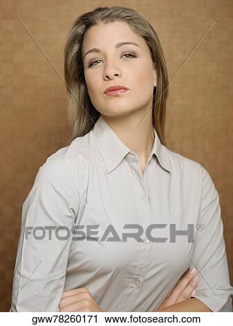 Portrait of a teenage girl with her arms crossed View Large Photo Image Stock Image - Portrait of a teenage girl with her arms crossed. Fotosearch