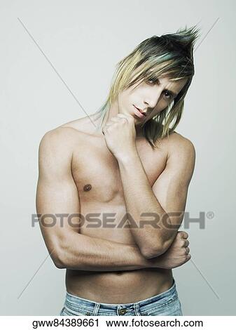 Portrait of a young man with hand on his chin View Large Photo Image Stock Image - Portrait of a young man with hand on his chin. Fotosearch