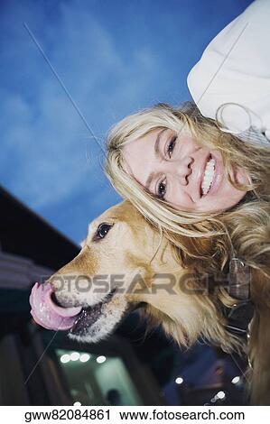 Portrait of a young woman smiling with her dog View Large Photo Image Stock Image - Portrait of a young woman smiling with her dog. Fotosearch