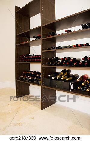 Alcoholic bottles on shelves View Large Photo Image Stock Image - Alcoholic bottles on shelves. Fotosearch