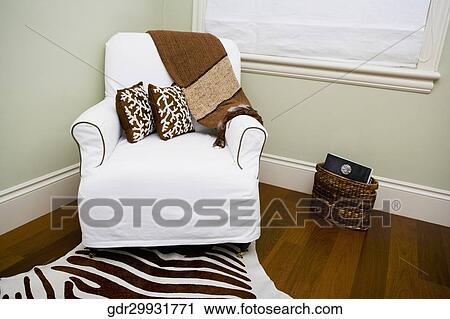 Armchair in a living room View Large Photo Image Stock Image - Armchair in a living room. Fotosearch