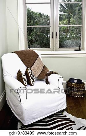 Stock Photo - Armchair in a living room. Fotosearch