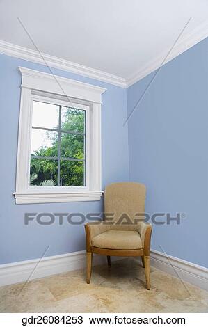 Armchair in a room View Large Photo Image Stock Image - Armchair in a room. Fotosearch