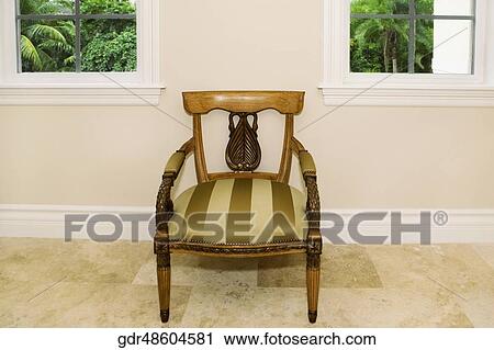 Armchair in a room View Large Photo Image Stock Image - Armchair in a room. Fotosearch