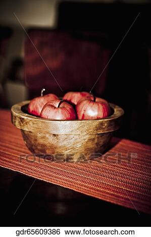 Artificial apples in a bowl on a table View Large Photo Image Stock Photograph - Artificial apples in a bowl on a table. Fotosearch