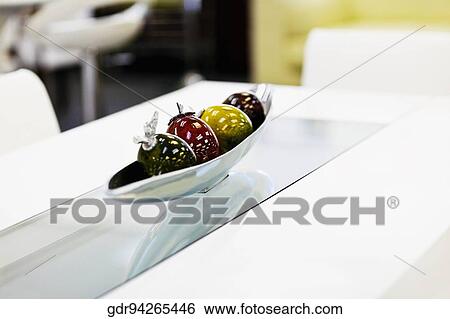Artificial fruits in a bowl on a dining table View Large Photo Image Stock Photograph - Artificial fruits in a bowl on a dining table. Fotosearch